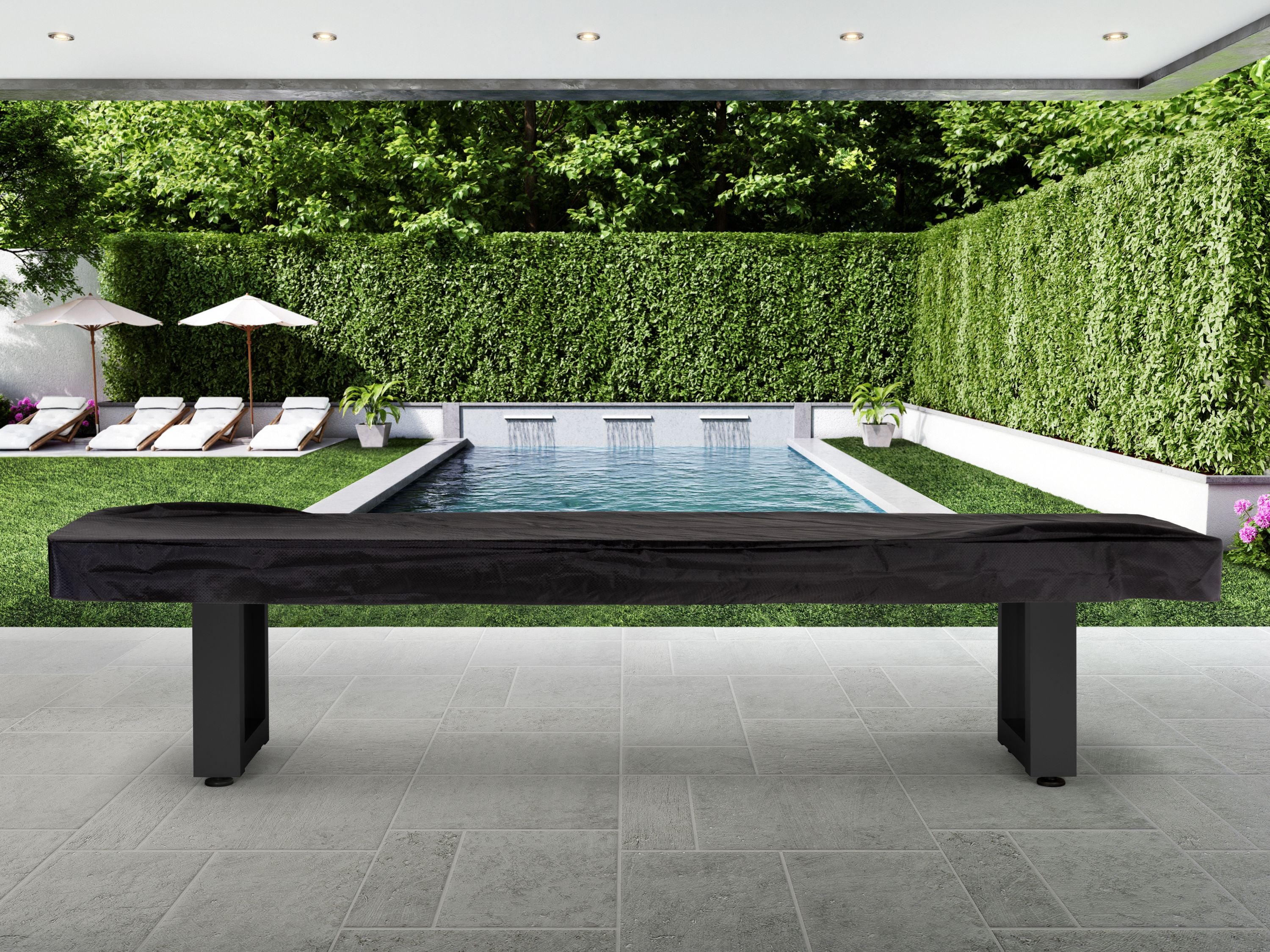 American Heritage Lanai 9' Outdoor Shuffleboard Table in Obsidian Black on a poolside patio.