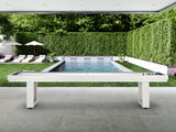 American Heritage Lanai 9' Outdoor Shuffleboard Table in Pearl White on a patio by a pool.