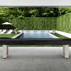 American Heritage Lanai 9' Outdoor Shuffleboard Table in Oyster Grey on patio by the pool.