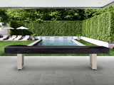 American Heritage Lanai 9' Outdoor Shuffleboard Table in Oyster Grey on patio by the pool.