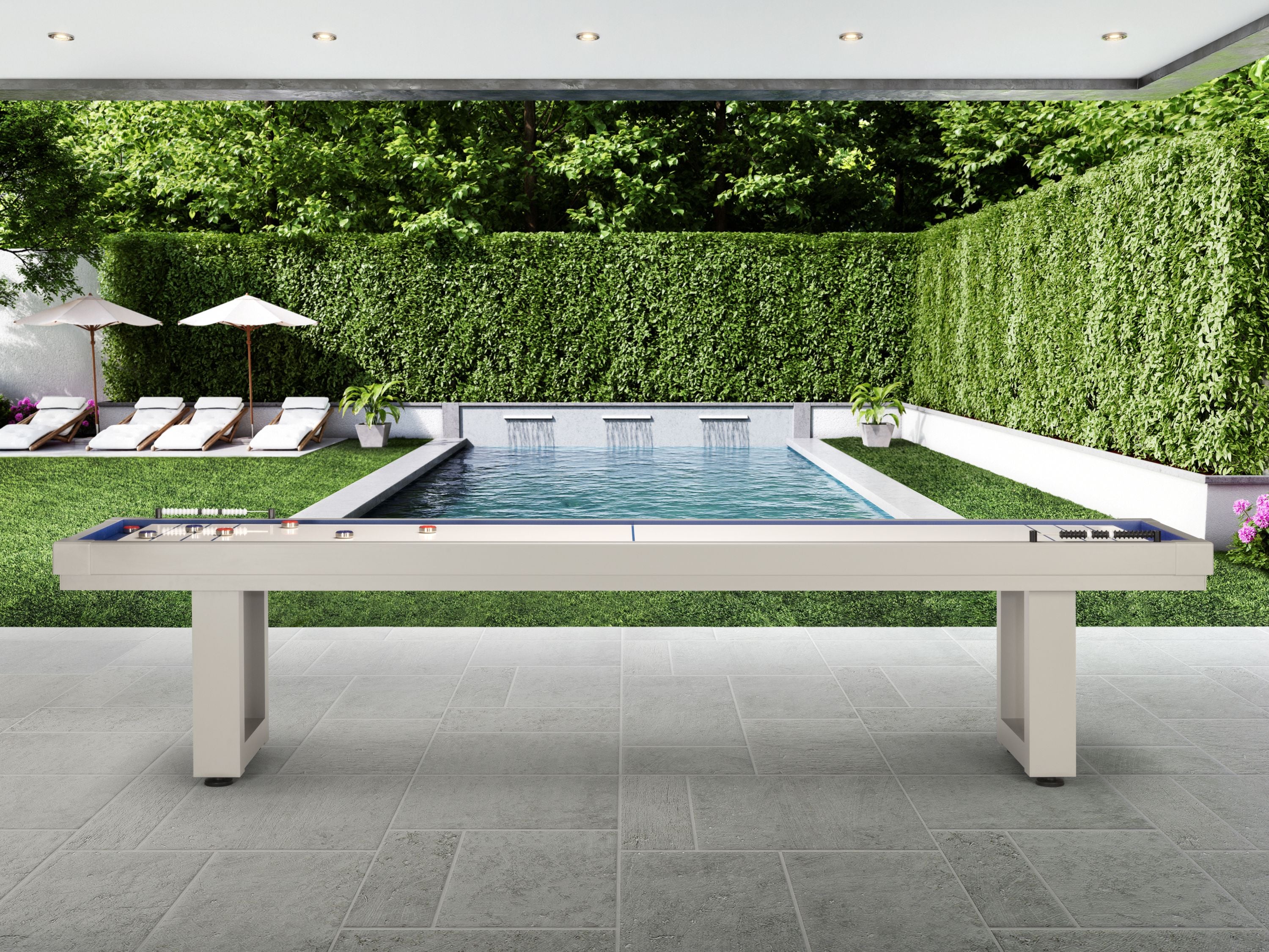 American Heritage Lanai 9' Outdoor Shuffleboard Table in Oyster Grey on a patio by the pool.