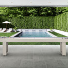 American Heritage Lanai 9' Outdoor Shuffleboard Table in Oyster Grey on a patio by the pool.