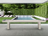 American Heritage Lanai 9' Outdoor Shuffleboard Table in Oyster Grey on a patio by the pool.